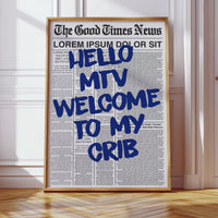 Framed newspaper with 'Hello MTV Welcome to my Crib' text in a room with wooden floor and white walls.