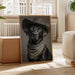 Framed portrait of a black dog with a bandana in a living room setting.