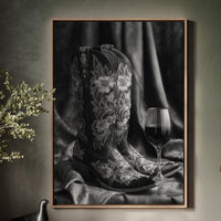 cowboy boots with a glass of wine hanging over cabinet 