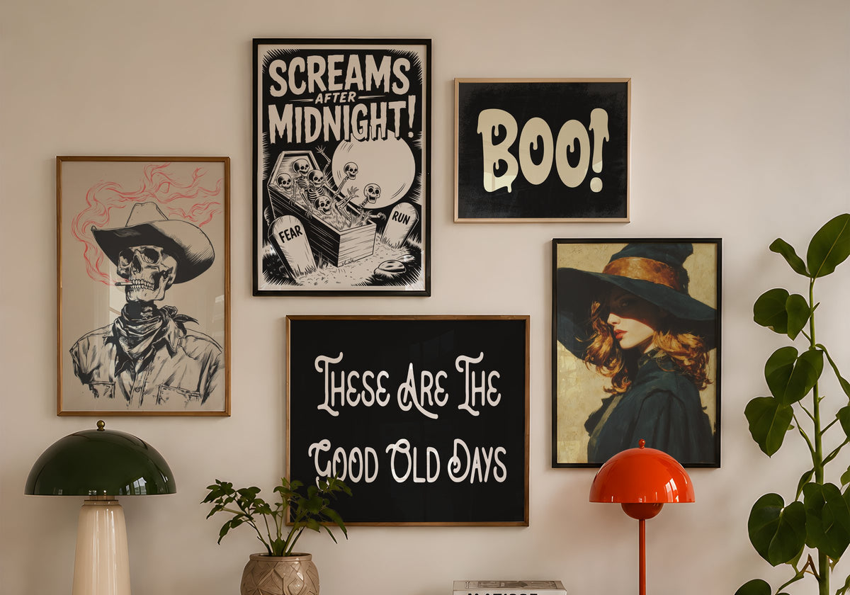 Halloween gallery wall of framed Kooly prints above a walnut sideboard