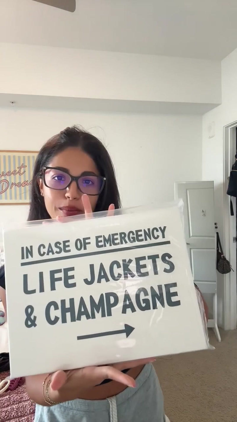 Chiara unboxing her Kooly Life Jackets and Champagne poster