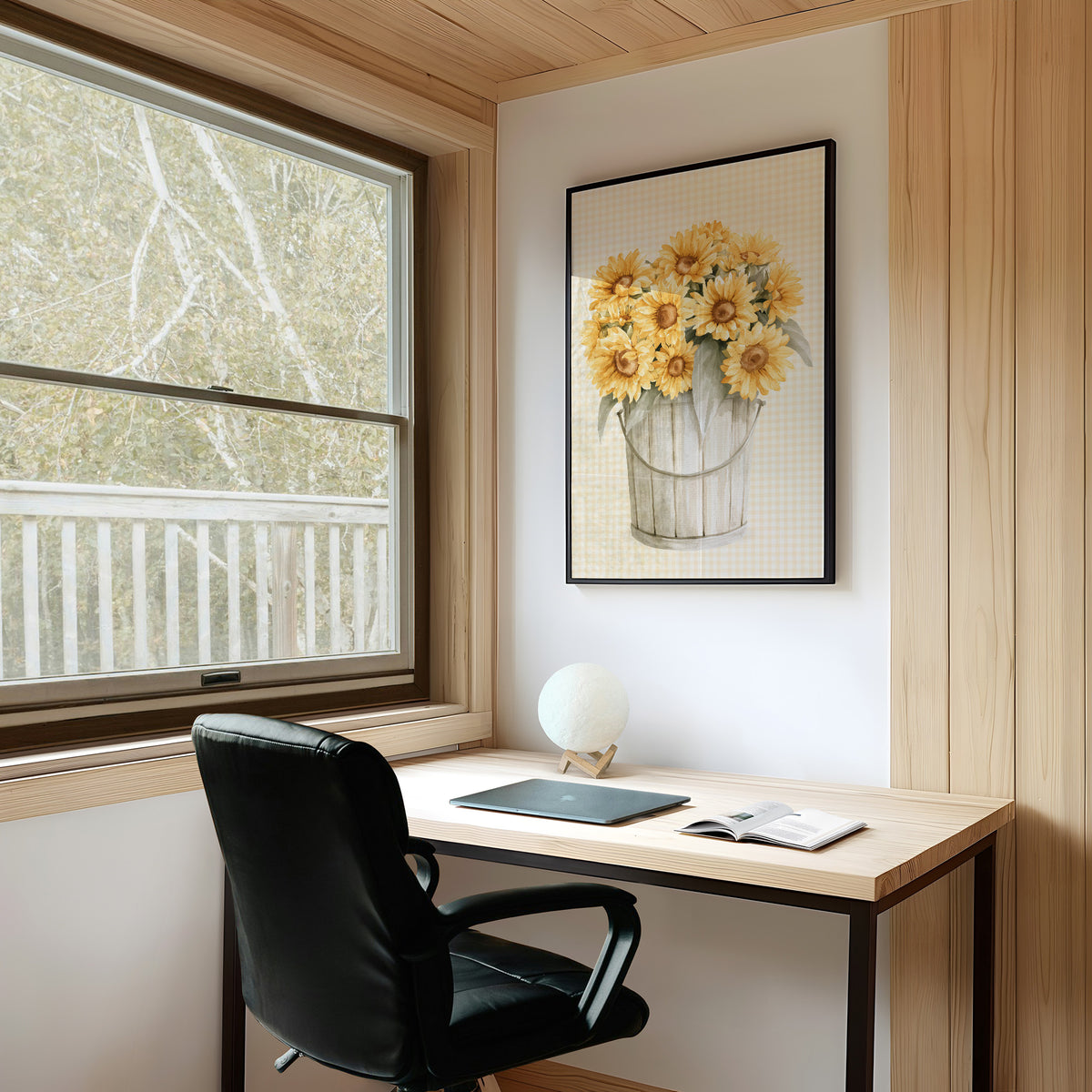 A Bucket of Sunlight Kept Indoors, a bouquet of yellow sunflowers and small blooms in a white metal pail, painted on a fine grid ground in gold, cream and sage, on a study wall above a writing desk and a black desk chair