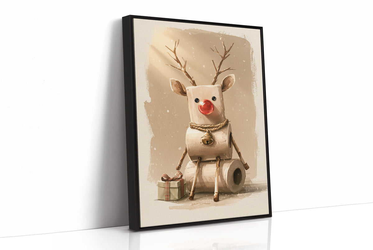 A Reindeer Takes a Seat, a cream reindeer with a red nose and small antlers seated on a stack of rolled tissue, with wrapped gift boxes at its feet, painted in cream, tan and soft red, as a framed canvas in a black frame