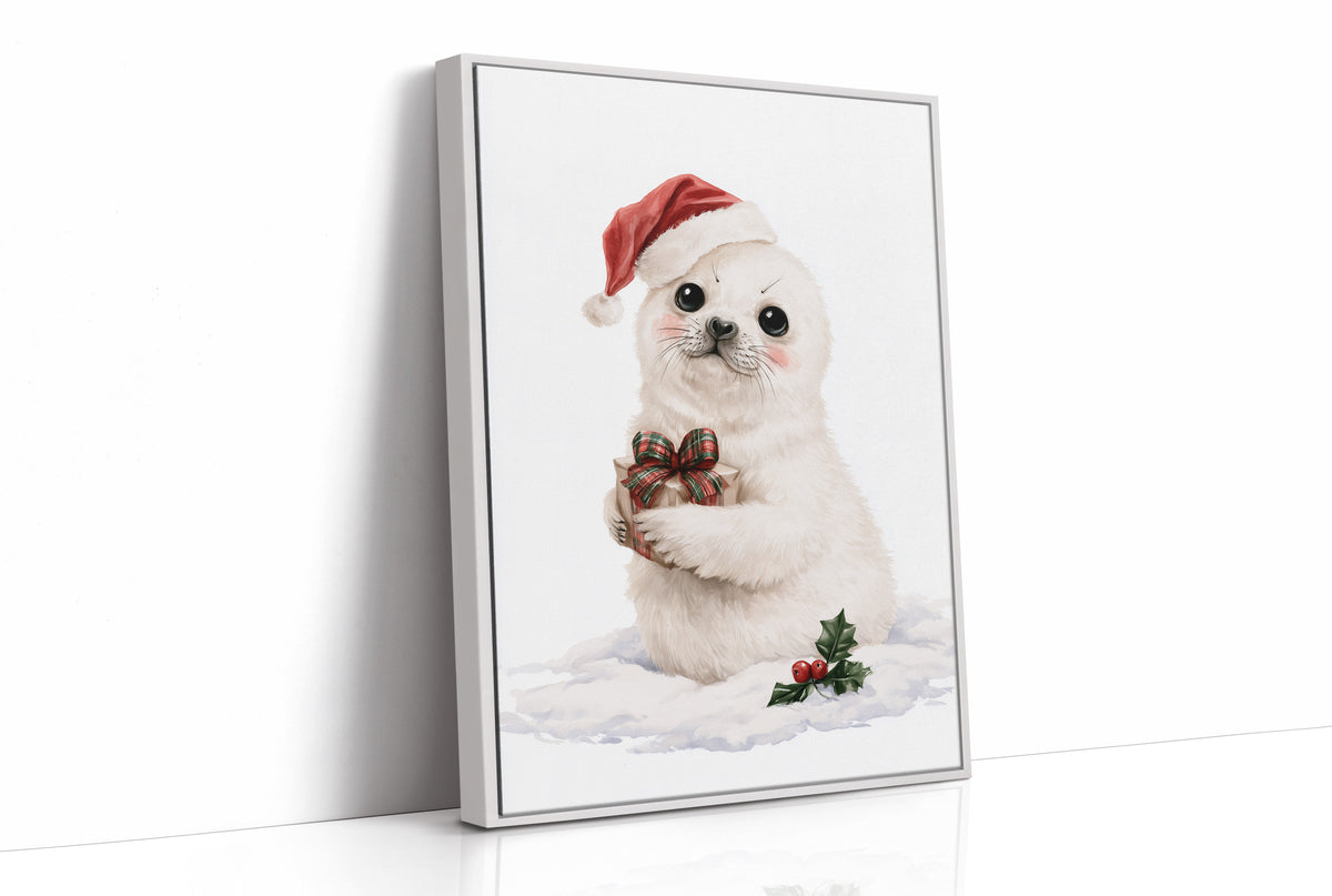 A Snowy Pup Waits for Morning, a white baby seal in a red Santa hat holding a chocolate bow, with a sprig of holly in the snow below, painted in soft cream, red and white, as a framed canvas in a white frame