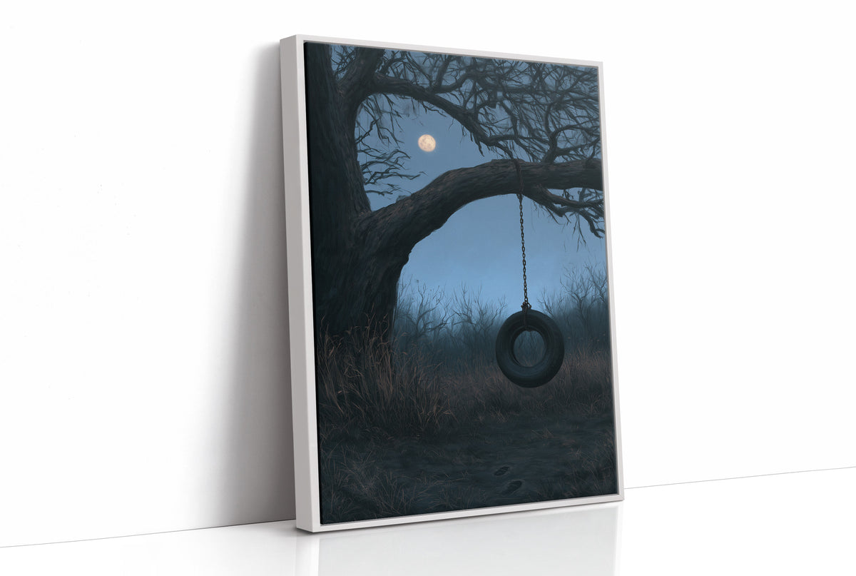 A Swing Left for the Moon, a bare tree with a dark tire swing hanging beneath a pale moon in a blue dusk field, painted in slate, midnight blue and moonlit cream, as a framed canvas in a white frame