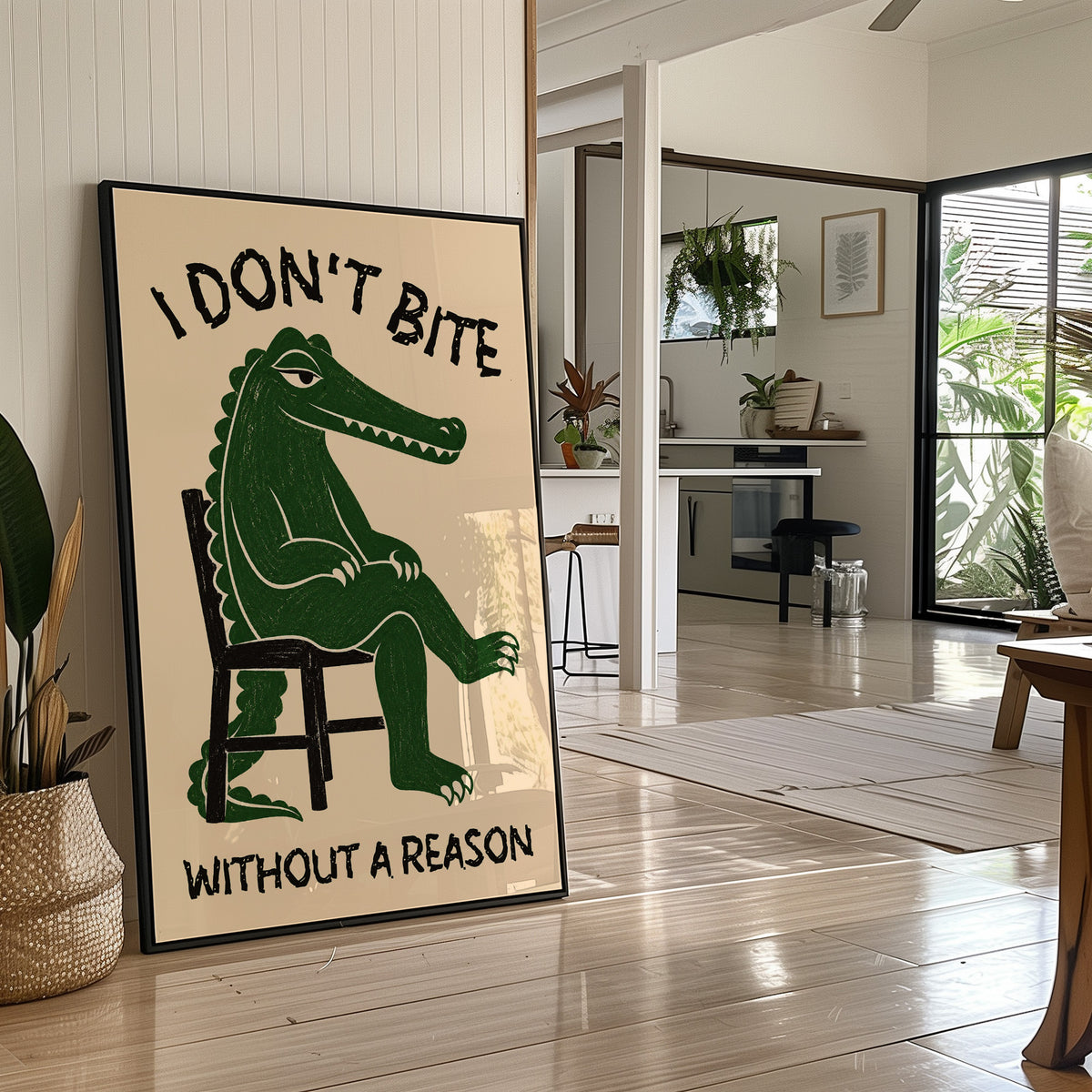 Bites Only With a Reason, a crocodile sitting upright in a plain wooden chair, in deep green on a cream ground, with a bold lettered line above reading I DON'T BITE and one below reading WITHOUT A REASON, in a black frame leaning on a bright hallway floor beside a potted plant