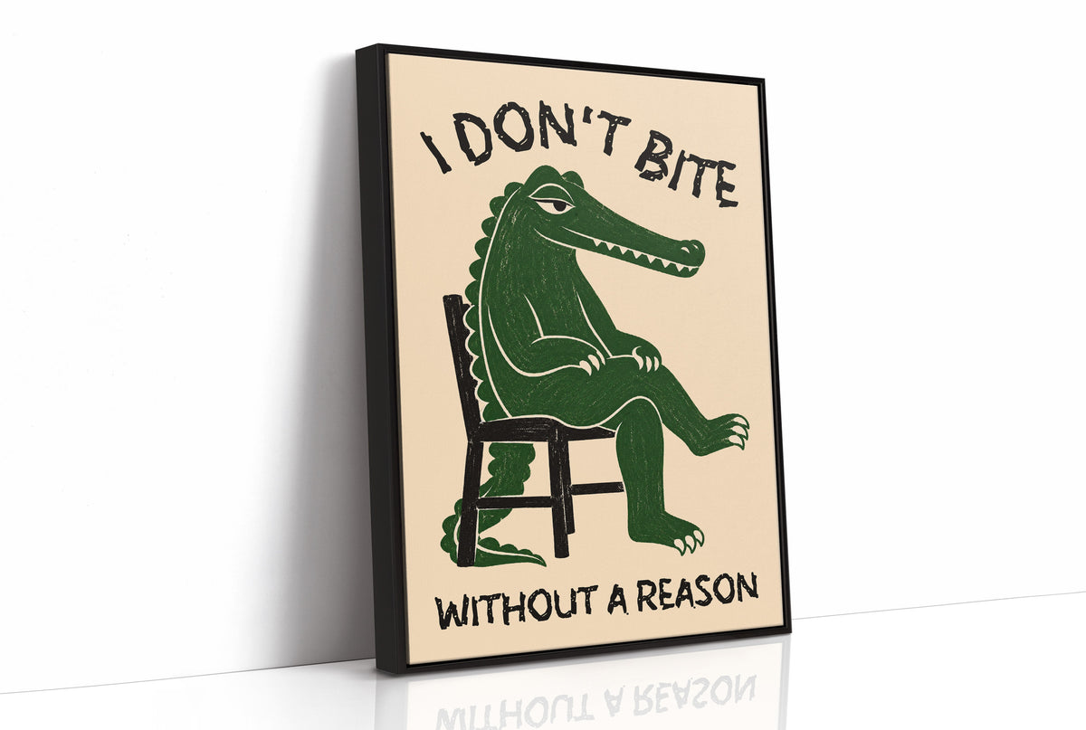Bites Only With a Reason, a crocodile sitting upright in a plain wooden chair, in deep green on a cream ground, with a bold lettered line above reading I DON'T BITE and one below reading WITHOUT A REASON, as a framed canvas in a black frame