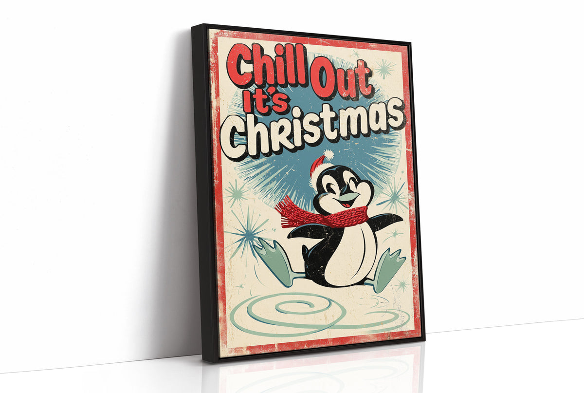 Chill Out, Cold Is Cozy, a vintage style penguin in a red scarf and a Santa hat sitting on a snowy patch, with a retro sign line of bold lettering above him, in red, cream and soft teal, as a framed canvas in a black frame