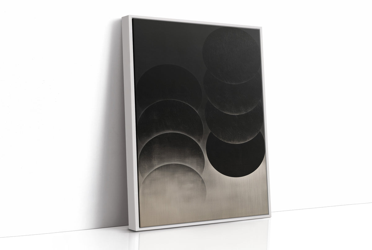 Circles Stacked in Graphite Silence, overlapping dark circles stacked in layers, black at the top fading to a pale graphite gradient at the bottom, minimal monochrome painting, as a framed canvas in a white frame