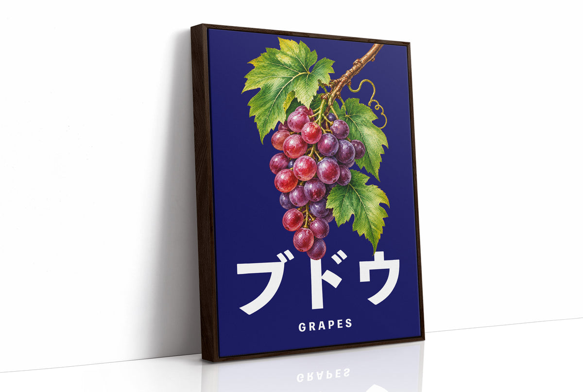 Clusters Heavy Over Midnight Water, a cluster of rose and purple grapes with green leaves hanging from a stem on a deep navy ground, with the Japanese katakana set in large white letters and the word GRAPES in small capitals beneath, as a framed canvas in a brown frame