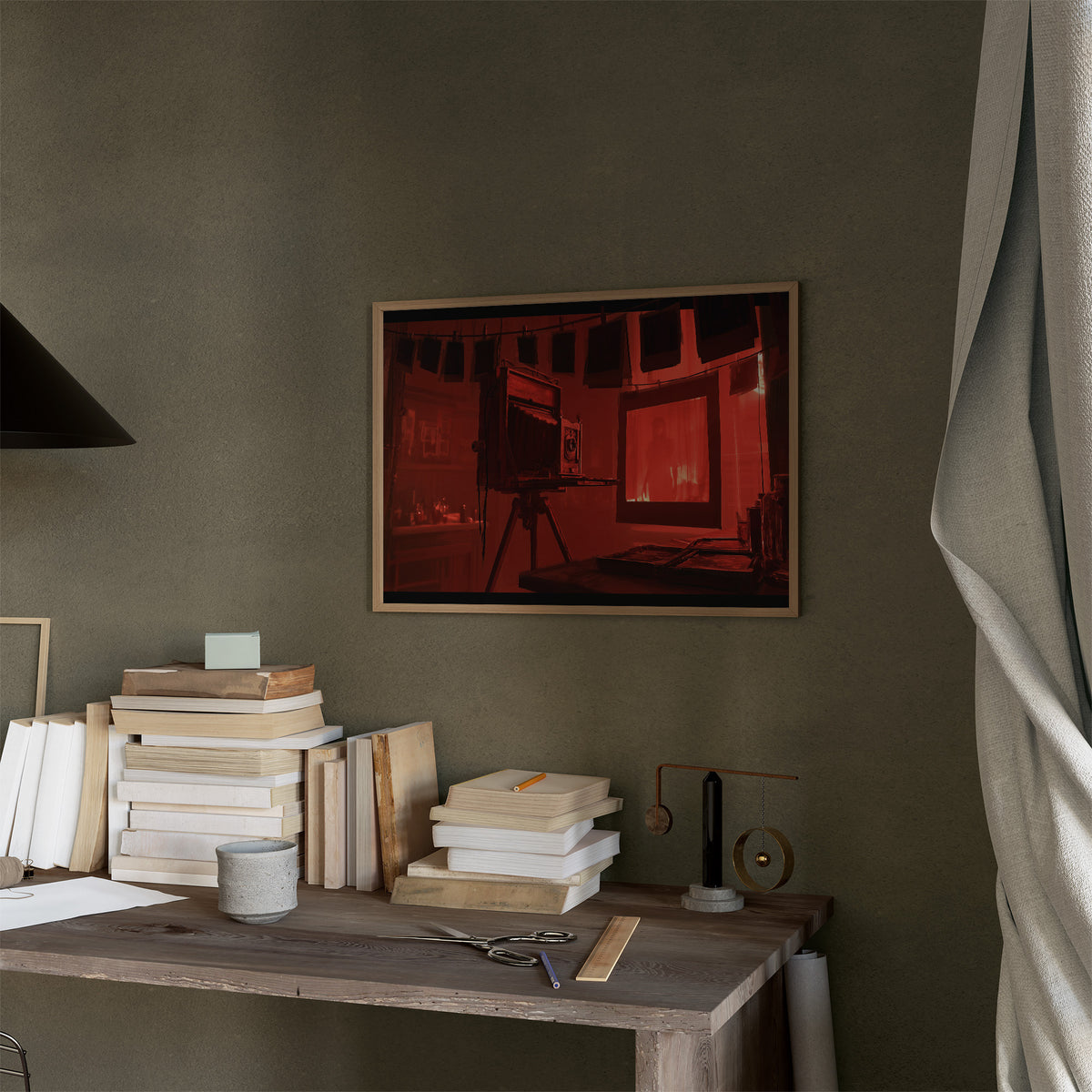 Developing in Deep Crimson, a vintage wooden view camera on a tripod in a red lit darkroom with a glowing doorway behind it, painted in crimson, umber and shadow black, in a thin wood frame on a moss green wall above a desk stacked with books