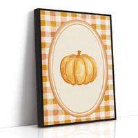 Dressed Up for a Quiet Afternoon, a single orange pumpkin in a cream oval medallion framed by a yellow and rust gingham border, painted in mustard, cream and burnt orange, as a framed canvas in a black frame
