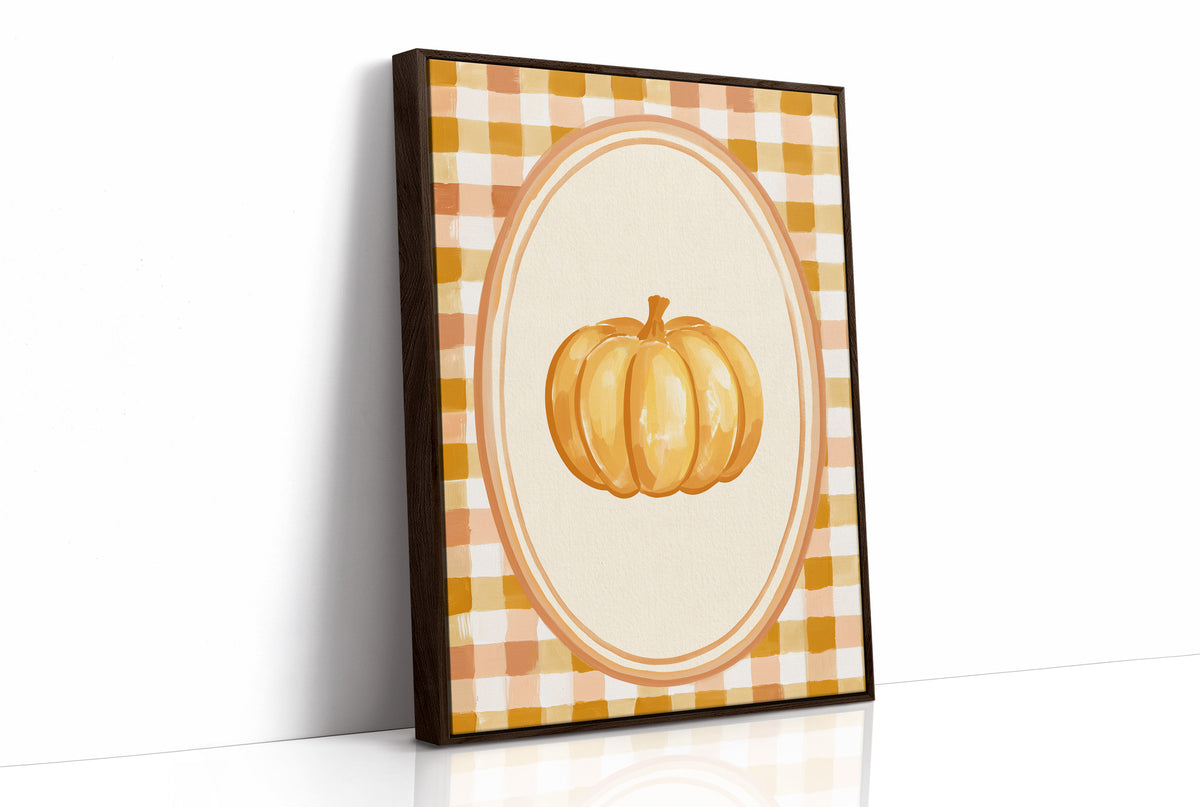 Dressed Up for a Quiet Afternoon, a single orange pumpkin in a cream oval medallion framed by a yellow and rust gingham border, painted in mustard, cream and burnt orange, as a framed canvas in a brown frame
