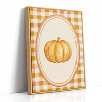 Dressed Up for a Quiet Afternoon, a single orange pumpkin in a cream oval medallion framed by a yellow and rust gingham border, painted in mustard, cream and burnt orange, as a framed canvas in a natural wood frame
