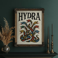 Every Head Grows Back Bolder, a many headed serpent with blue, red and gold scales rising in fans of heads, in a bold flash sheet style with a black lettered name across the top on a cream ground, in an ornate gold frame on a deep green wall beside tall brass candlesticks