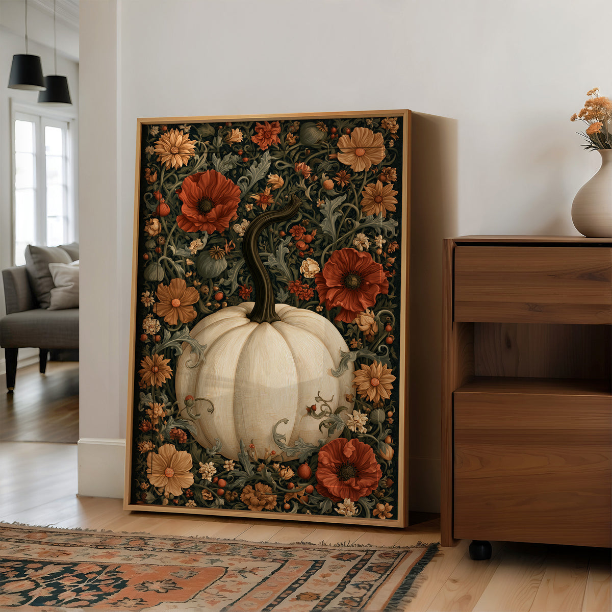 Finest Florals on a Round Gourd, a pale pumpkin wearing red poppies, peach blooms and curling vines against a dark green damask ground, painted in cream, oxblood and deep green, in a wood frame on a wall beside a walnut cabinet and an open doorway