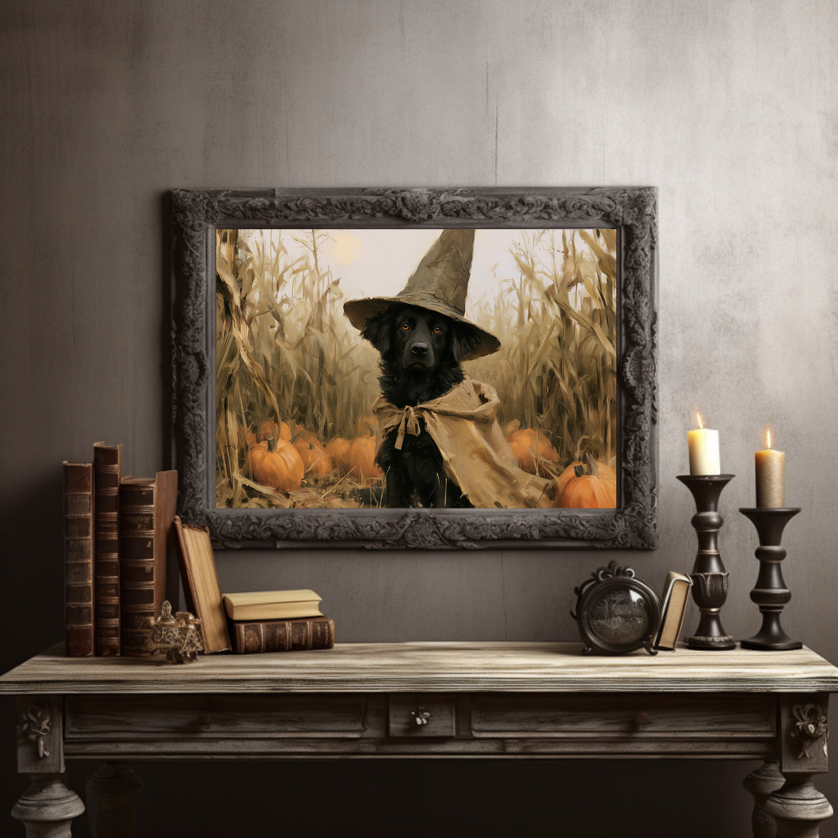 Good Boy, Bad Spell, black dog in a witch hat in a pumpkin patch painting, in a dark carved frame on a gray wall above a console table with candlesticks and old books
