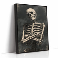 He Keeps His Arms Folded, a seated skeleton with crossed arms and bare ribs against a smoky charcoal ground, painted in bone, charcoal and ash gray, as a framed canvas in a black frame