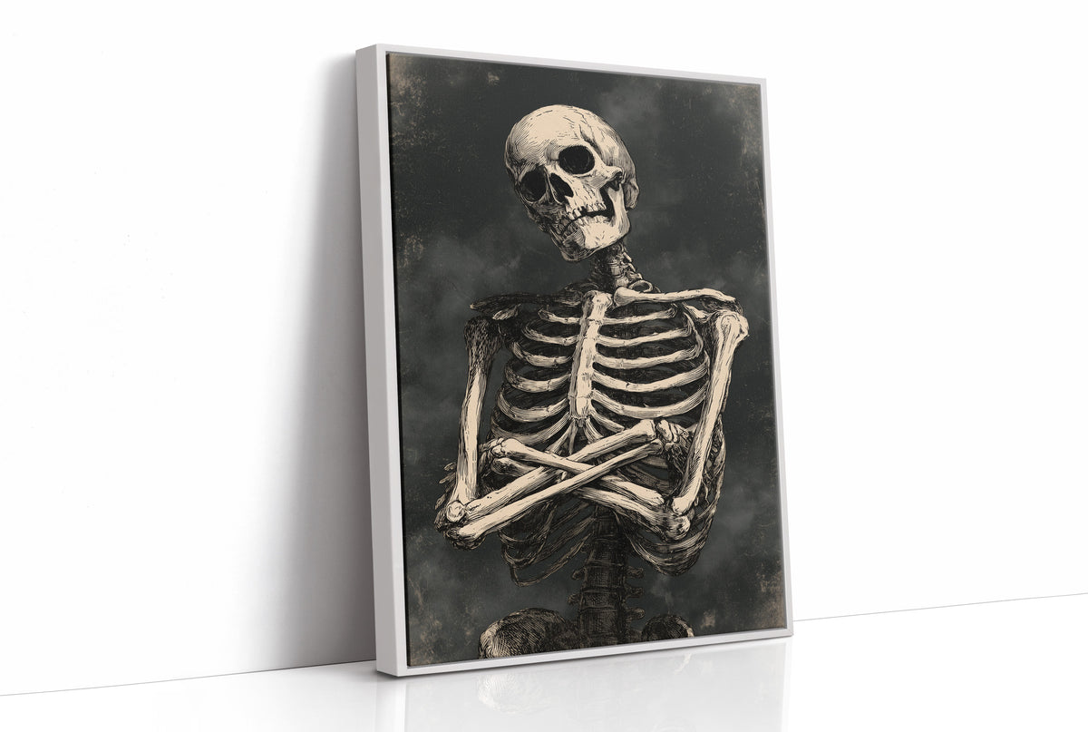 He Keeps His Arms Folded, a seated skeleton with crossed arms and bare ribs against a smoky charcoal ground, painted in bone, charcoal and ash gray, as a framed canvas in a white frame