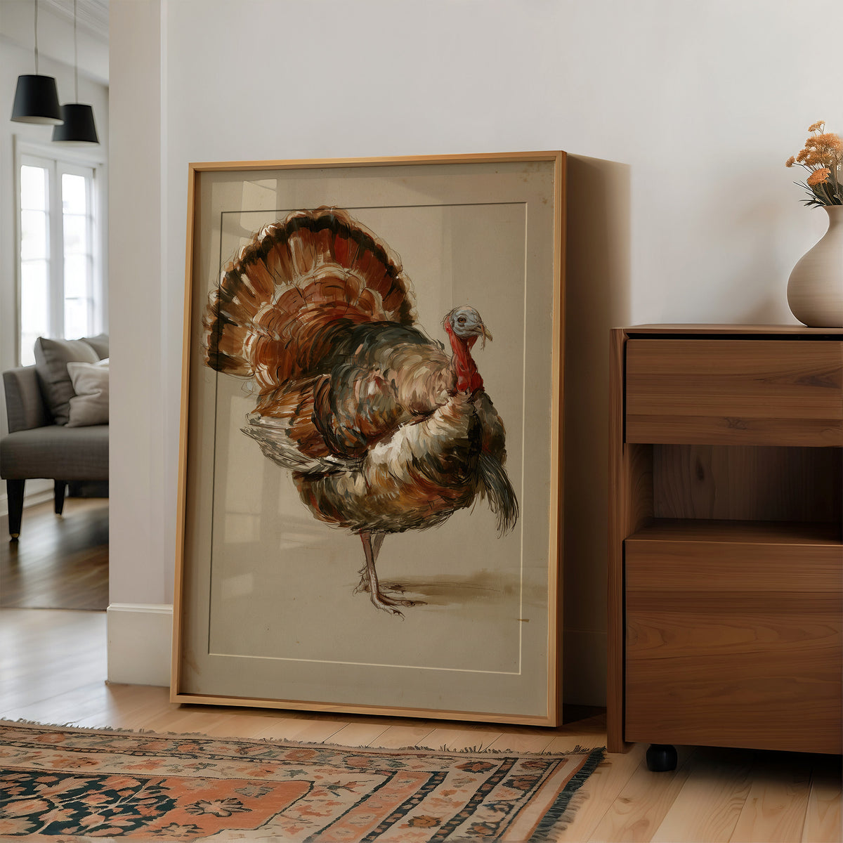 He Keeps His Feathers Open, a vintage painting of a wild turkey standing on a warm taupe ground, with rust, bronze and umber plumage and a tail half raised, in a wood frame on a wall beside a walnut cabinet and an open doorway