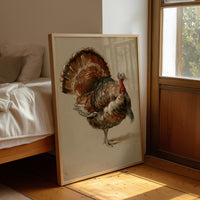 He Keeps His Feathers Open, a vintage painting of a wild turkey standing on a warm taupe ground, with rust, bronze and umber plumage and a tail half raised, leaning on a wood floor in a bedroom beside white linen bedding
