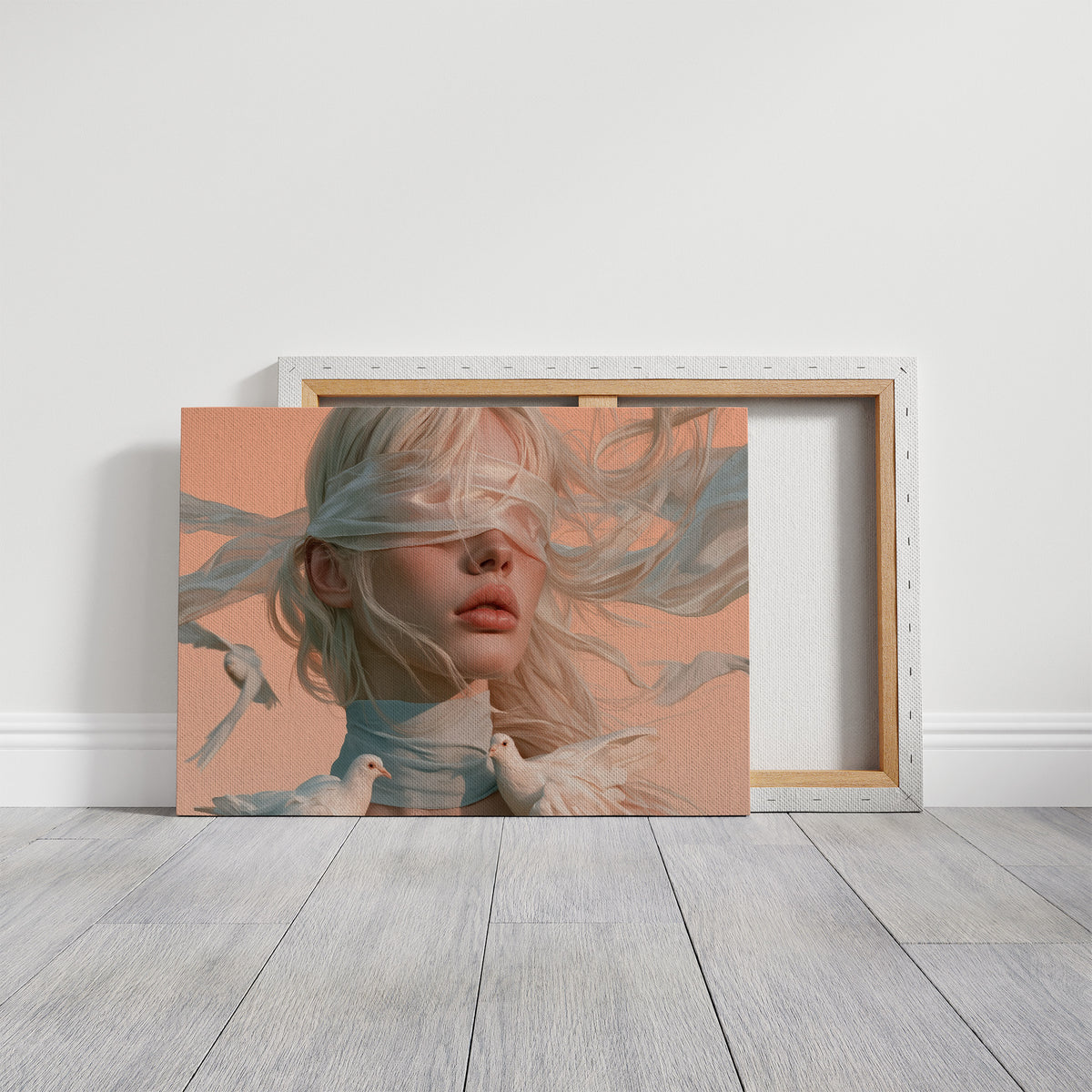 Hush of Silk and Sky, a veiled woman with a white silk scarf over her eyes and a dove at her shoulder, painted in peach, dusty blue and cream, on a gallery canvas with wrapped edges leaning against a white wall