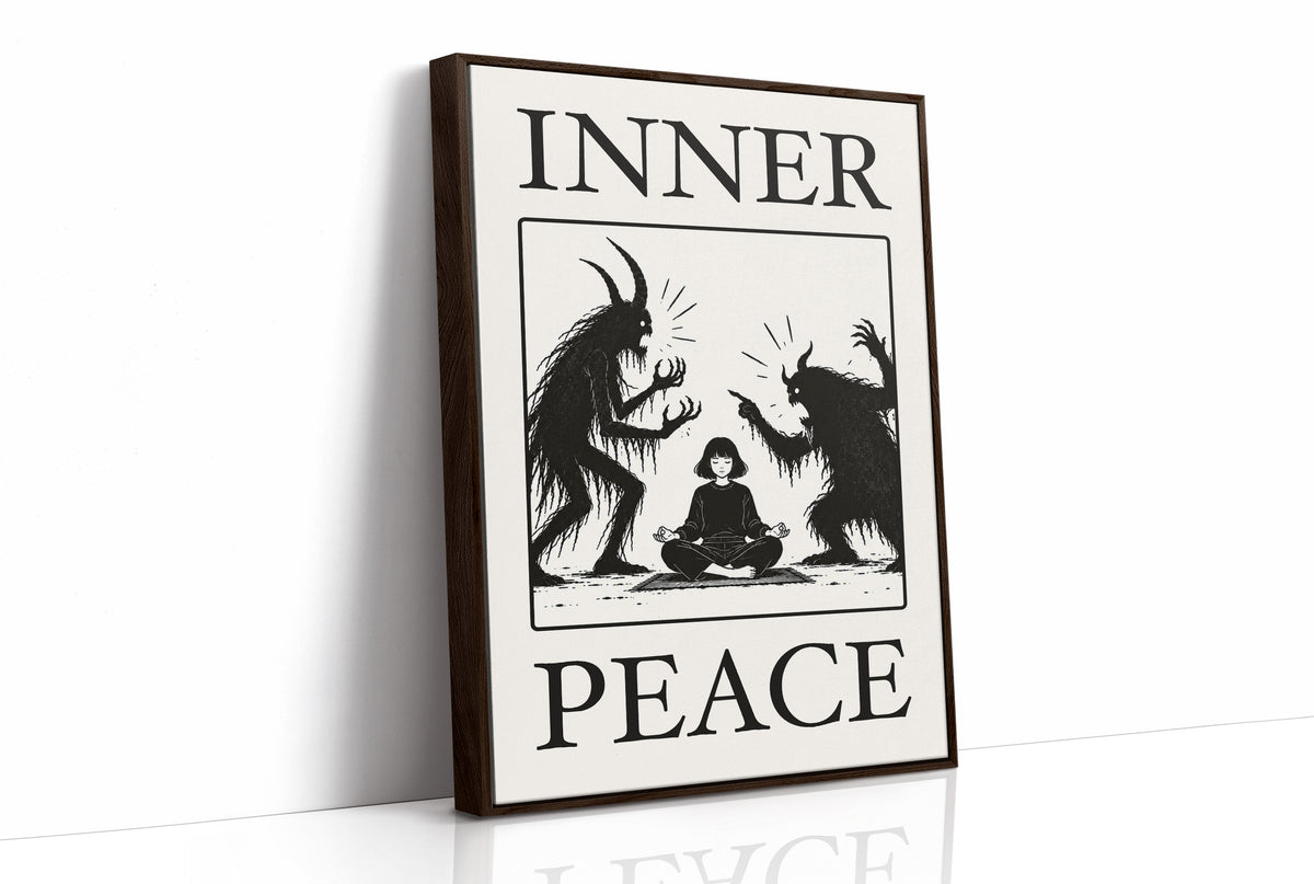 Inner Peace Has Company, two horned shadow figures in black flanking a small seated figure meditating at the base, cream ground in a black serif frame, with INNER above and PEACE below, as a framed canvas in a brown frame