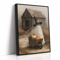 Just Passing Through, Boo, a ghost in a witch hat pushing a wheelbarrow of pumpkins past a weathered shed, painted in straw, gray and pale white, as a framed canvas in a black frame