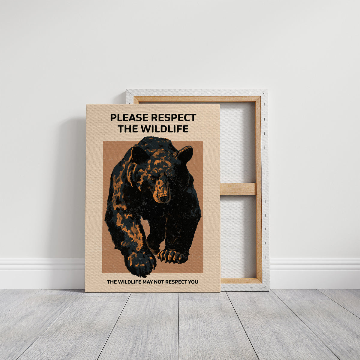 Keep a Respectful Distance, a large black bear with amber and brown fur, head low and shoulders bunched, set on a tan ground under bold black lettering that reads PLEASE RESPECT THE WILDLIFE in a vintage warning sign style, on a gallery canvas with wrapped edges leaning against a white wall