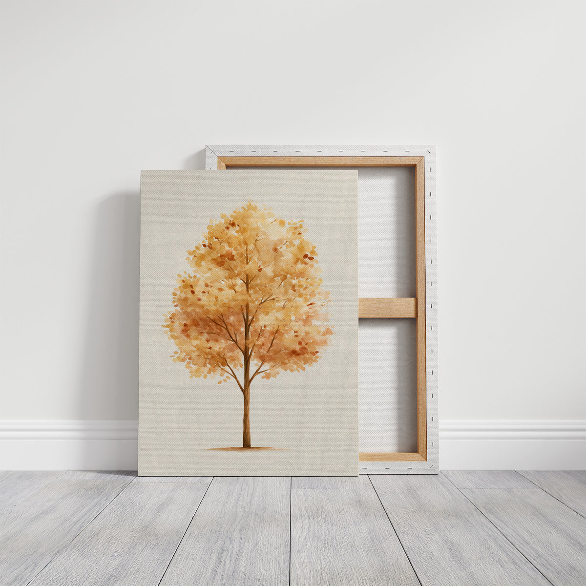 Keeping Its Warmth a Little Longer, a single watercolor tree in amber and rust with a soft brown trunk on a cream ground, the leaves painted in loose soft strokes, on a gallery canvas with wrapped edges leaning against a white wall