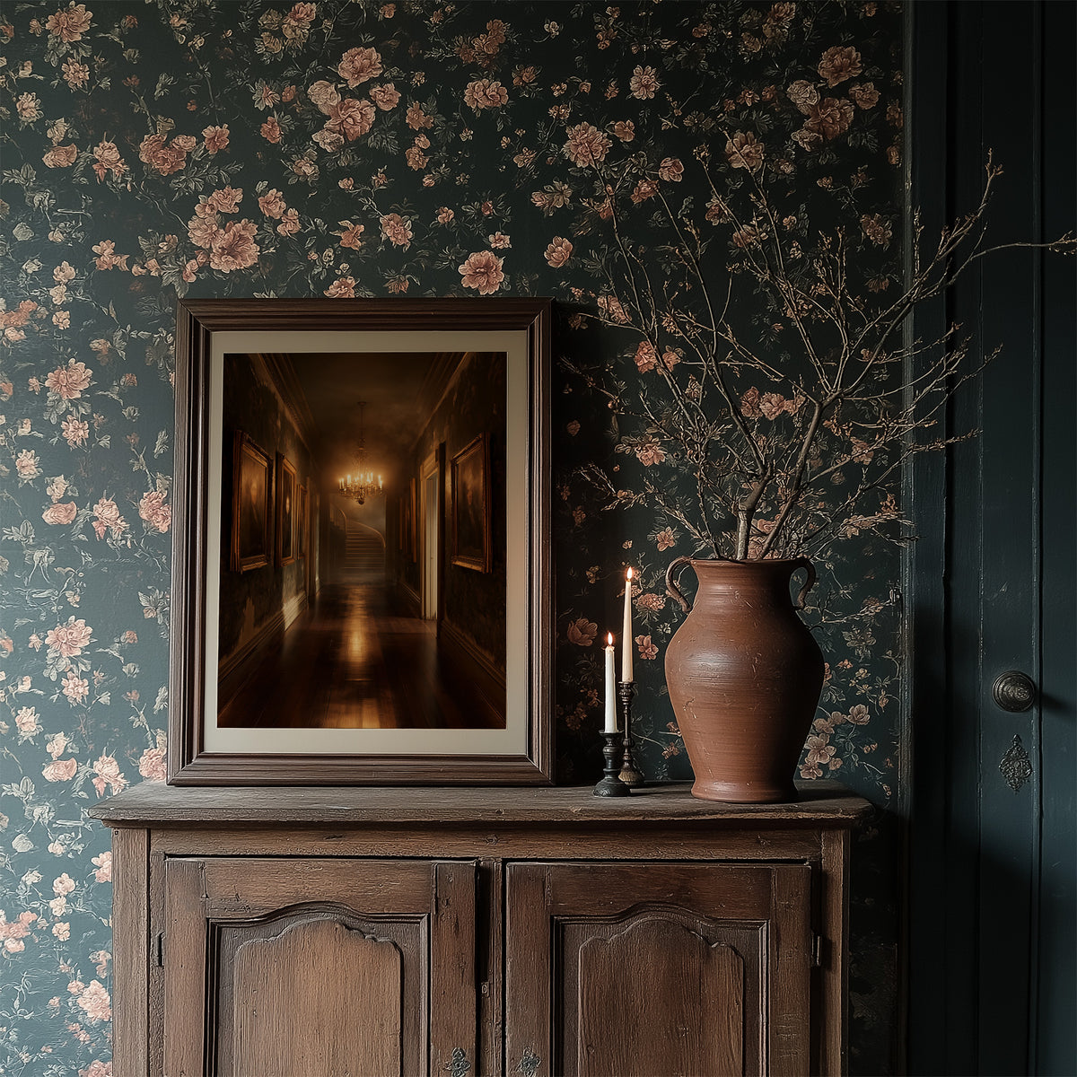 Lamps Left Burning in the Hall, a long dim corridor with carved doors and a glowing chandelier at the far end, painted in umber, amber and deep shadow, in a dark frame on a wooden dresser against floral wallpaper