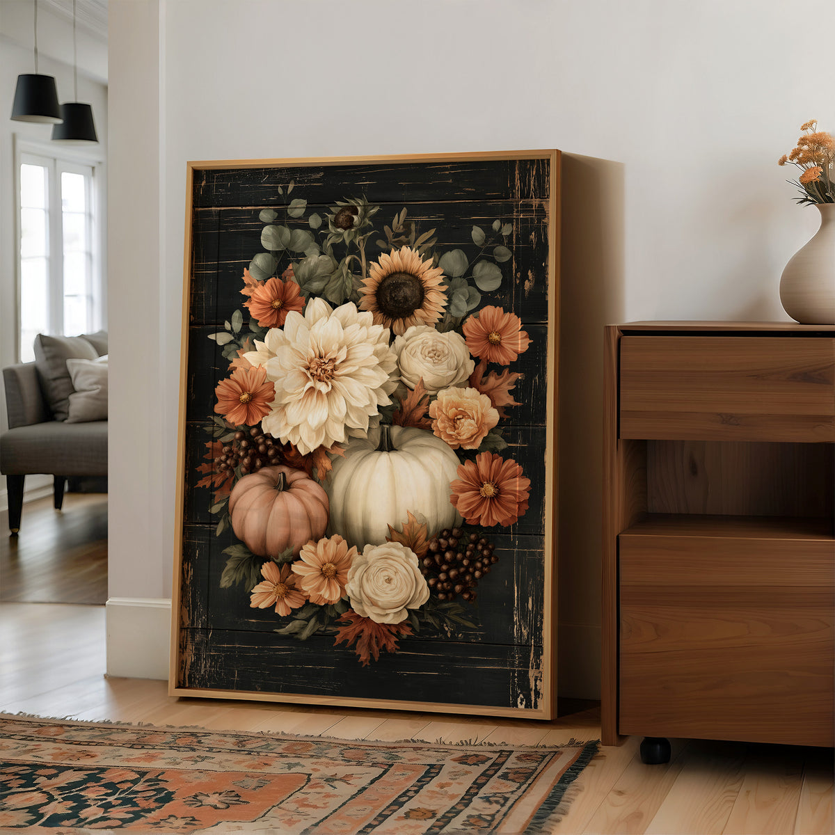 Late Blooms Remember the Harvest, a dark floral bouquet of dahlias, cream roses and small pumpkins with eucalyptus, painted in cream, rust and burnt orange on a black ground, in a wood frame on a wall beside a walnut cabinet and an open doorway