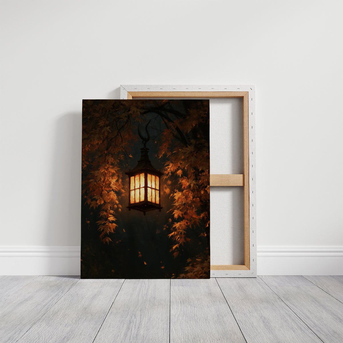 Left On for Someone, a glowing iron lantern hanging in a dark thicket of rust and amber leaves, painted in deep brown, ember orange and warm gold, on a gallery canvas with wrapped edges leaning against a white wall