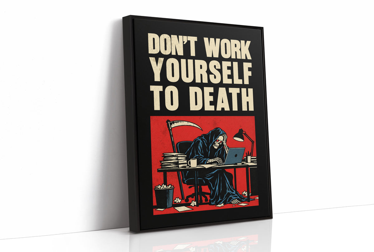 Let the Inbox Wait Till Monday, a hooded reaper hunched over a cluttered desk with a laptop and a stack of files, in a red panel with the lettering DON'T WORK YOURSELF TO DEATH in heavy cream capitals on black, as a framed canvas in a black frame