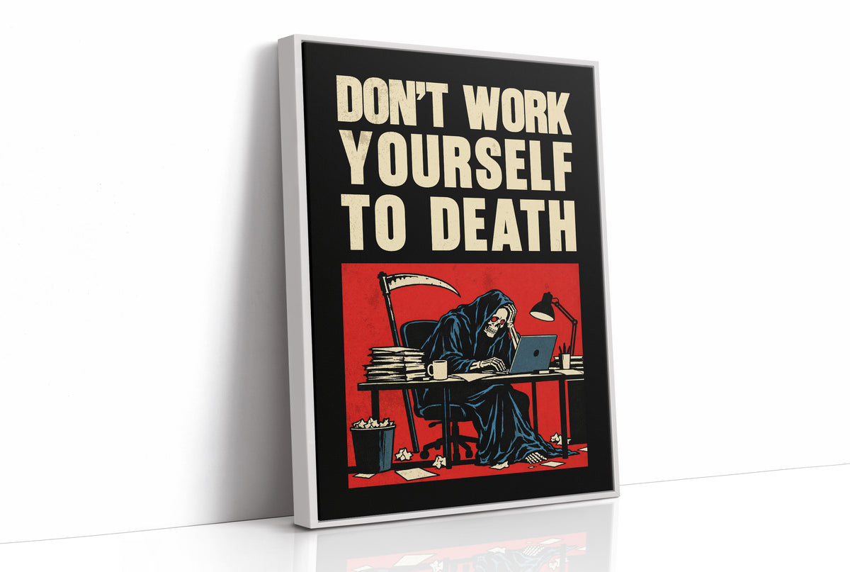 Let the Inbox Wait Till Monday, a hooded reaper hunched over a cluttered desk with a laptop and a stack of files, in a red panel with the lettering DON'T WORK YOURSELF TO DEATH in heavy cream capitals on black, as a framed canvas in a white frame
