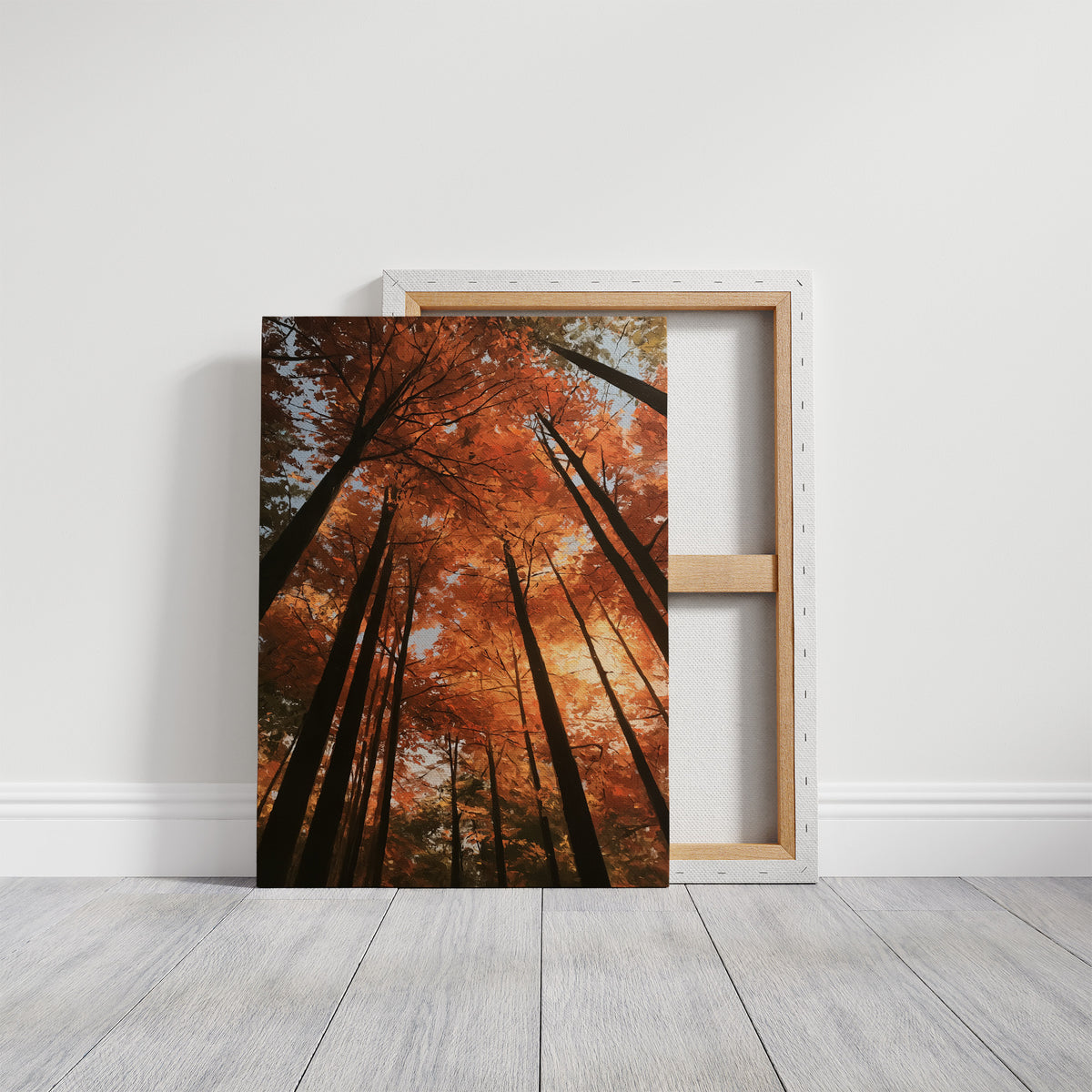 Look Up Into the Burning Wood, looking straight up through a canopy of tall dark trunks and orange autumn foliage, the pale sky glowing behind them, painted in rust, burnt orange and charcoal, on a gallery canvas with wrapped edges leaning against a white wall