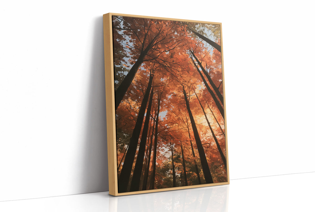 Look Up Into the Burning Wood, looking straight up through a canopy of tall dark trunks and orange autumn foliage, the pale sky glowing behind them, painted in rust, burnt orange and charcoal, as a framed canvas in a natural wood frame
