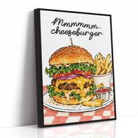 Mmmm Cheeseburger Makes Everything Better, a stacked cheeseburger with lettuce, tomato, cheese and a sesame bun beside fries and ketchup cups on a red and white checkered plate, with the lettering Mmmmm cheeseburger in black script across the top, as a framed canvas in a black frame