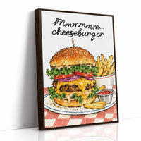 Mmmm Cheeseburger Makes Everything Better, a stacked cheeseburger with lettuce, tomato, cheese and a sesame bun beside fries and ketchup cups on a red and white checkered plate, with the lettering Mmmmm cheeseburger in black script across the top, as a framed canvas in a brown frame
