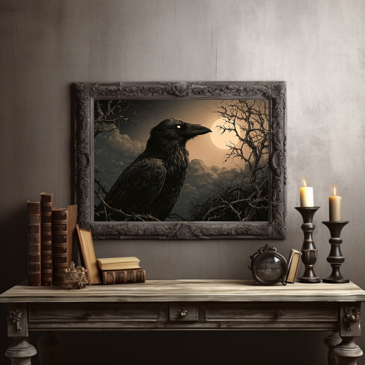 Moonrise Over the Bare Branches, a black raven perched on dark limbs beneath a pale moon in a low sepia fog, painted in charcoal, umber and moonlit gold, in a dark carved frame on a gray wall above a console table with candlesticks and old books