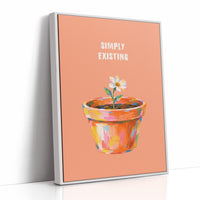 One Small Bloom in Clay, a single white flower rising from a painted clay pot in coral, gold and pink brushstrokes, on a peach ground with two lines of bold pale lettering above, in a loose painterly style, as a framed canvas in a white frame