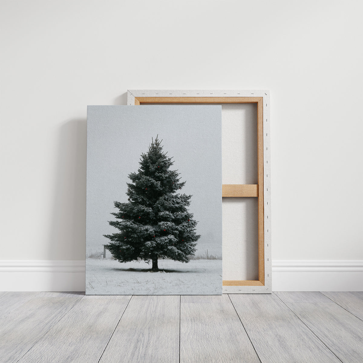 One Spruce Holds the Snowfield, a single dark spruce standing alone in a snowy field under a pale gray sky, painted in forest green, snow white and soft gray, on a gallery canvas with wrapped edges leaning against a white wall