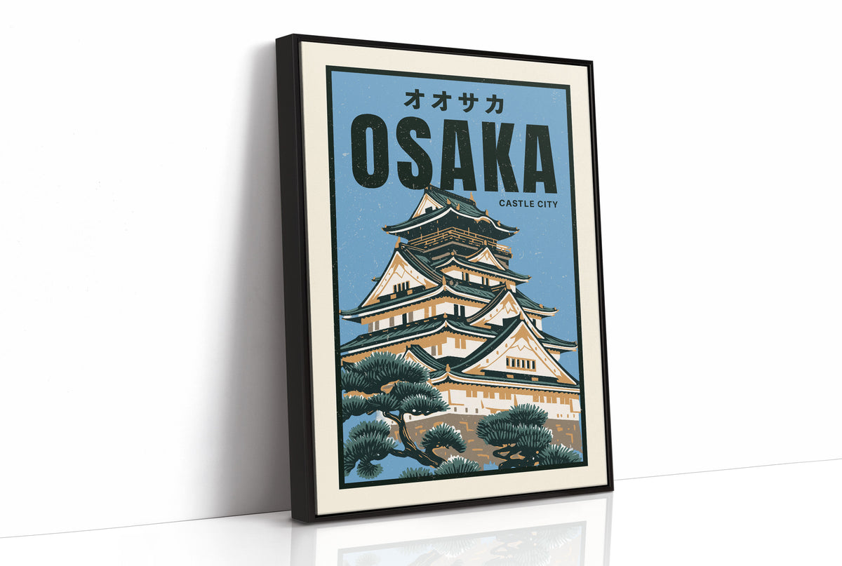 Osaka Castle Above the Evening Glow, a Japanese castle with tiered black roofs and white walls rising above green pines, in a flat travel poster style on a pale blue ground, with the katakana above and the word OSAKA in bold black capitals and CASTLE CITY in small type below, as a framed canvas in a black frame