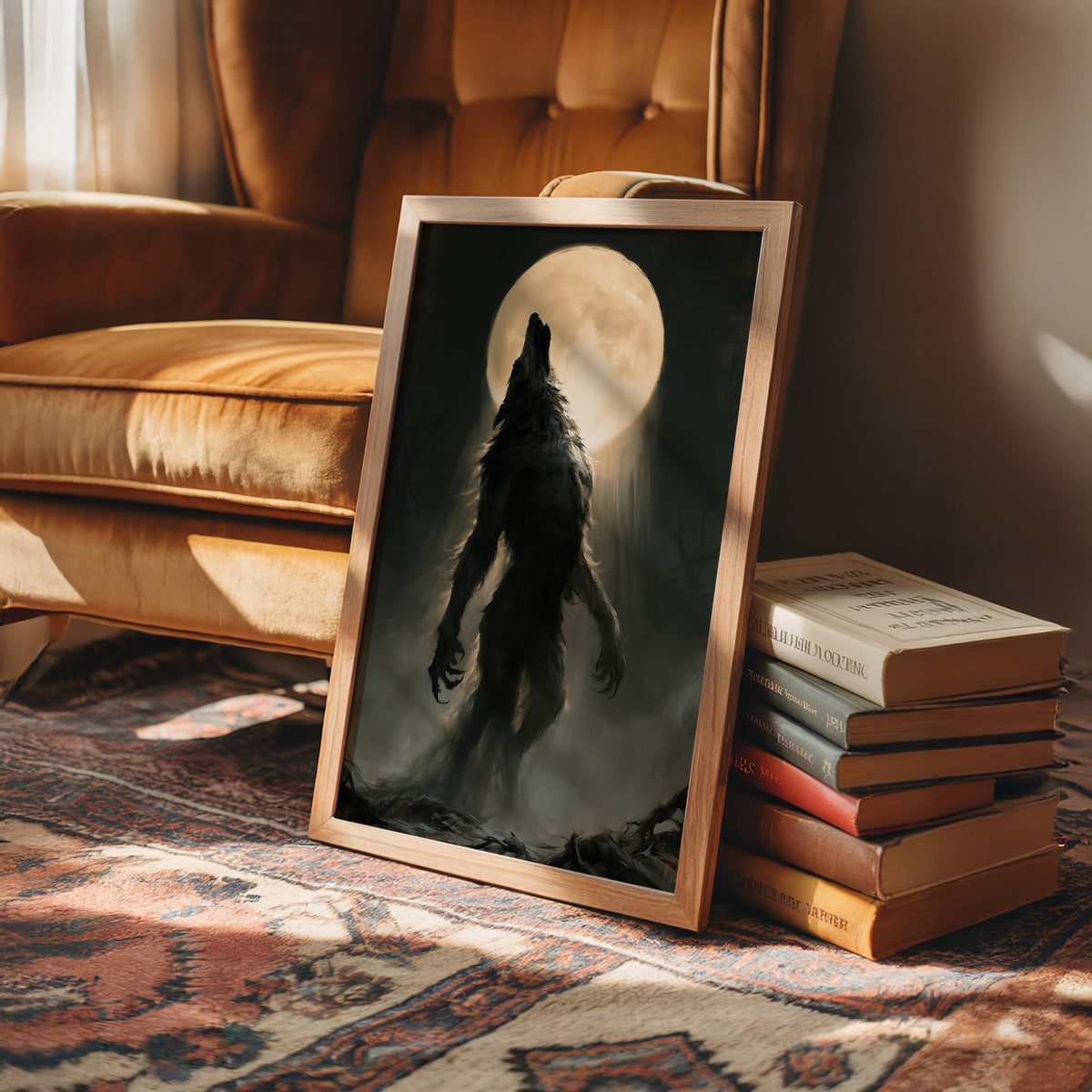 Patience Under a Pale Moon, a hunched werewolf standing in mist with its head raised toward a glowing full moon, painted in charcoal, olive and bone, in a wood frame on a leather armchair beside a stack of books