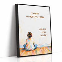 Quiet Hours on Painted Floors, a child seen from behind sitting cross legged on painted floorboards in coral, blue and cream, with two lines of bold brown lettering on a pale cream ground, in a soft illustrated style, as a framed canvas in a black frame