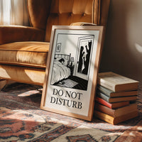 Quiet Hours Until Someone Knocks, a black ink woodcut style scene of a woman asleep in bed beside a lamp and a small framed plant picture while horned shadows lurk at the open door, and the words DO NOT DISTURB in black serif capitals on cream paper, in an ornate frame on silk cloth beside ferns and a brass compass