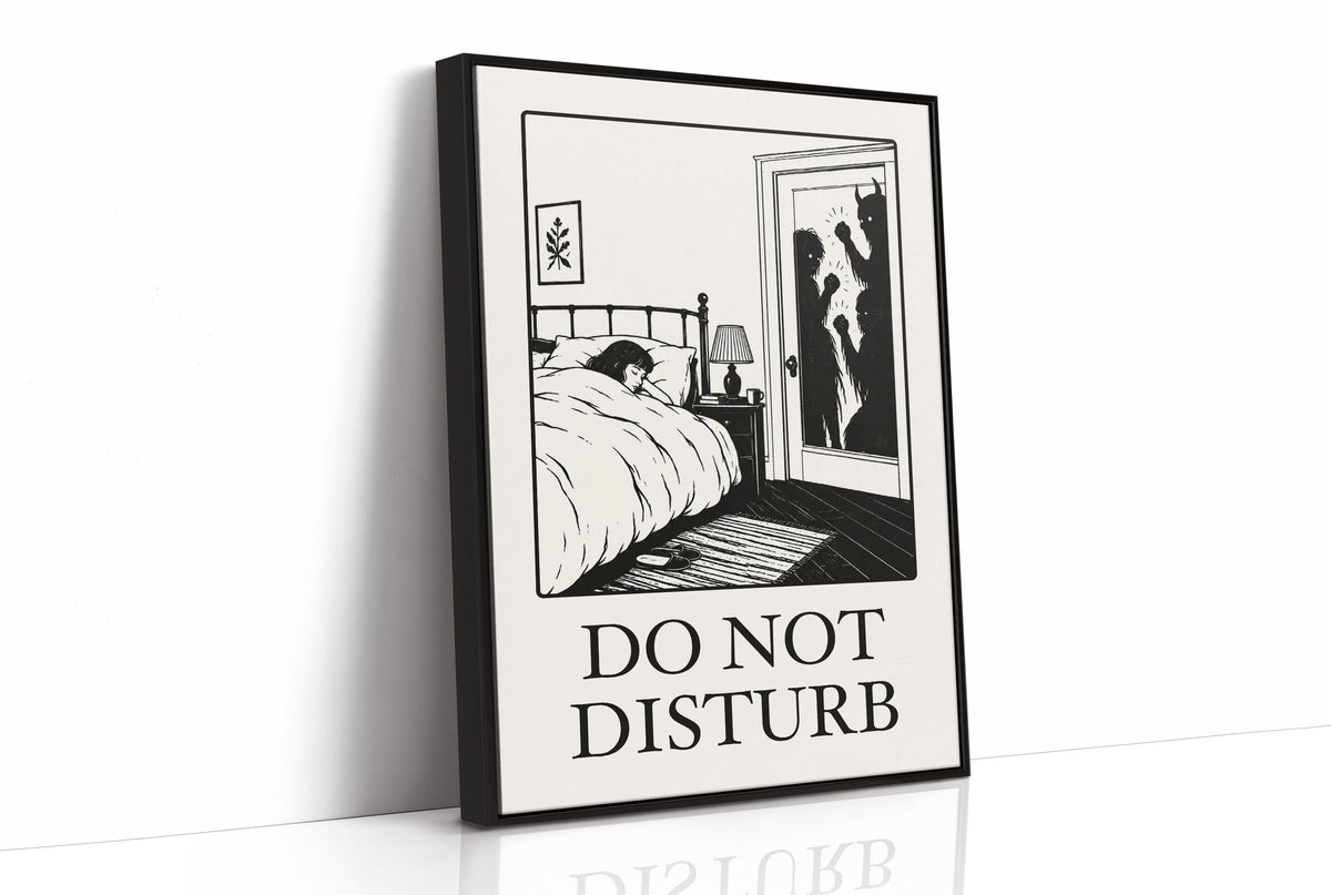 Quiet Hours Until Someone Knocks, a black ink woodcut style scene of a woman asleep in bed beside a lamp and a small framed plant picture while horned shadows lurk at the open door, and the words DO NOT DISTURB in black serif capitals on cream paper, as a framed canvas in a black frame