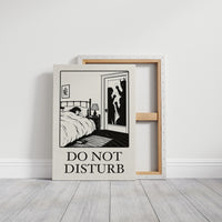 Quiet Hours Until Someone Knocks, a black ink woodcut style scene of a woman asleep in bed beside a lamp and a small framed plant picture while horned shadows lurk at the open door, and the words DO NOT DISTURB in black serif capitals on cream paper, on a gallery canvas with wrapped edges leaning against a white wall