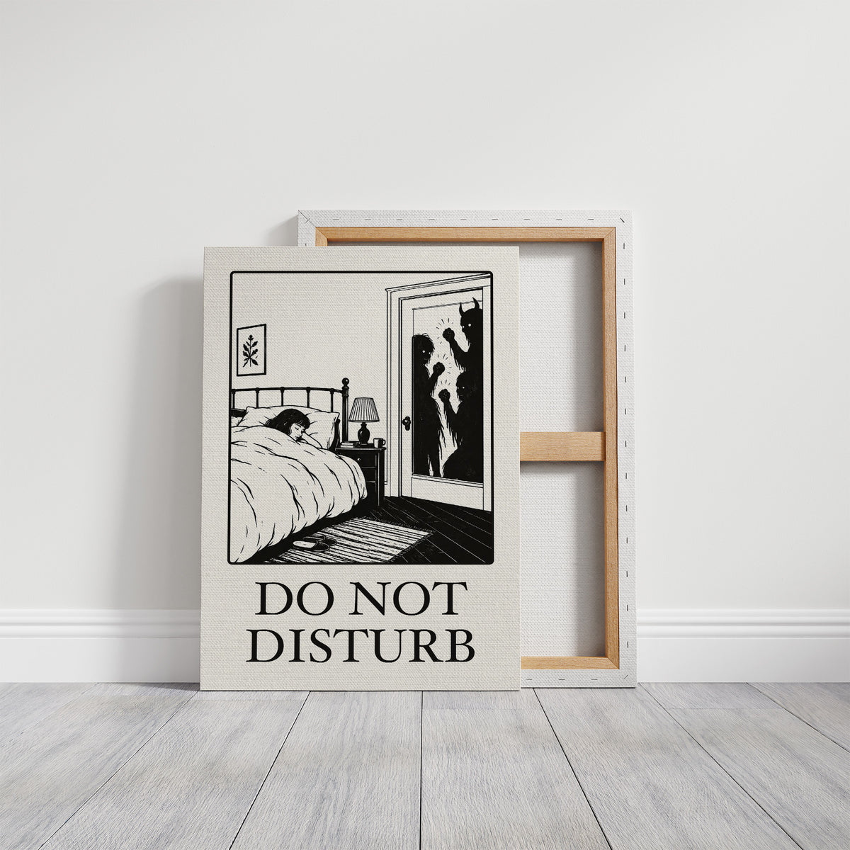 Quiet Hours Until Someone Knocks, a black ink woodcut style scene of a woman asleep in bed beside a lamp and a small framed plant picture while horned shadows lurk at the open door, and the words DO NOT DISTURB in black serif capitals on cream paper, on a gallery canvas with wrapped edges leaning against a white wall