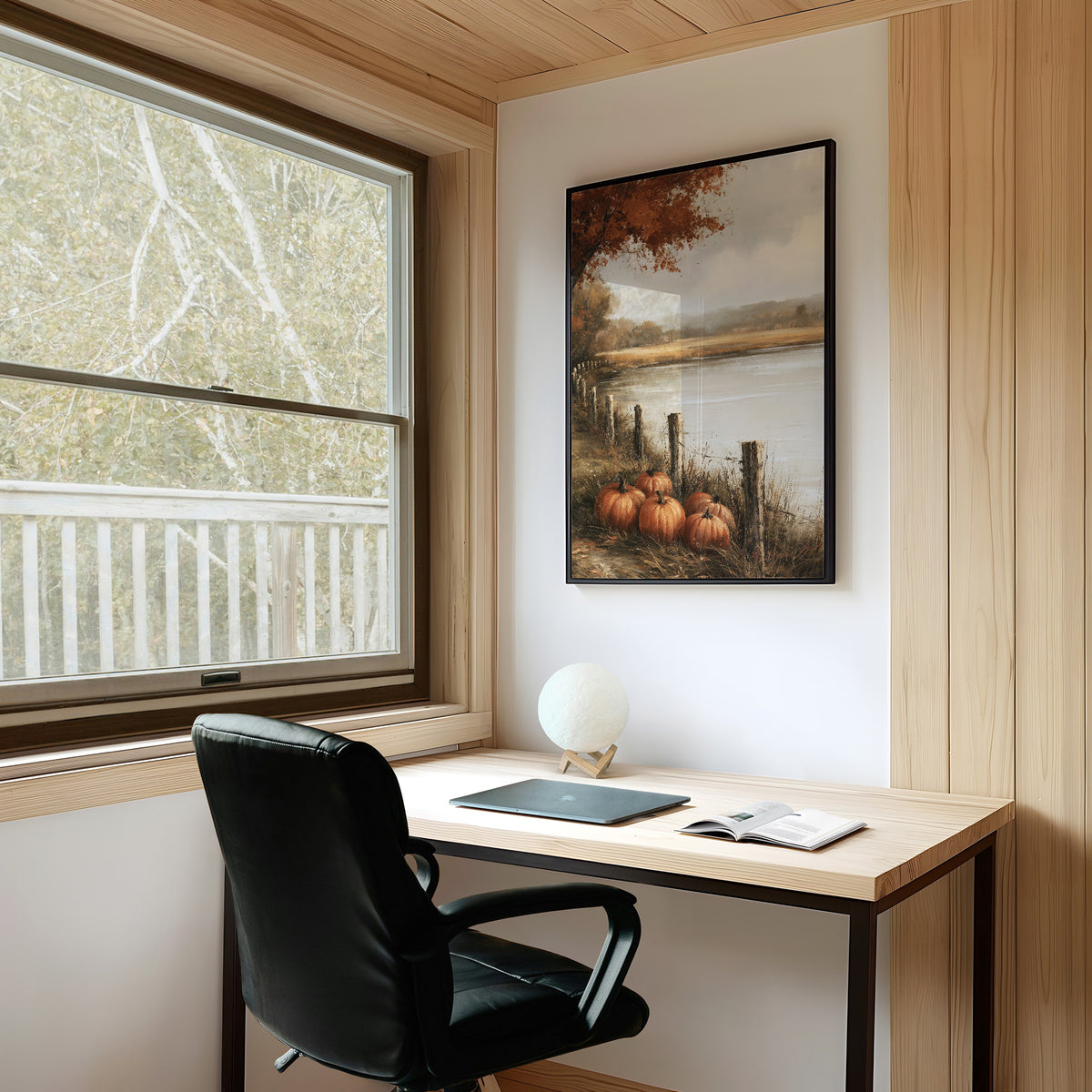 Quiet Water at the Fence Line, weathered fence posts and orange pumpkins on a grassy bank beside a misty lake, with a russet tree leaning over the water, painted in soft ochre, rust and pale gray, on a study wall above a writing desk and a black desk chair